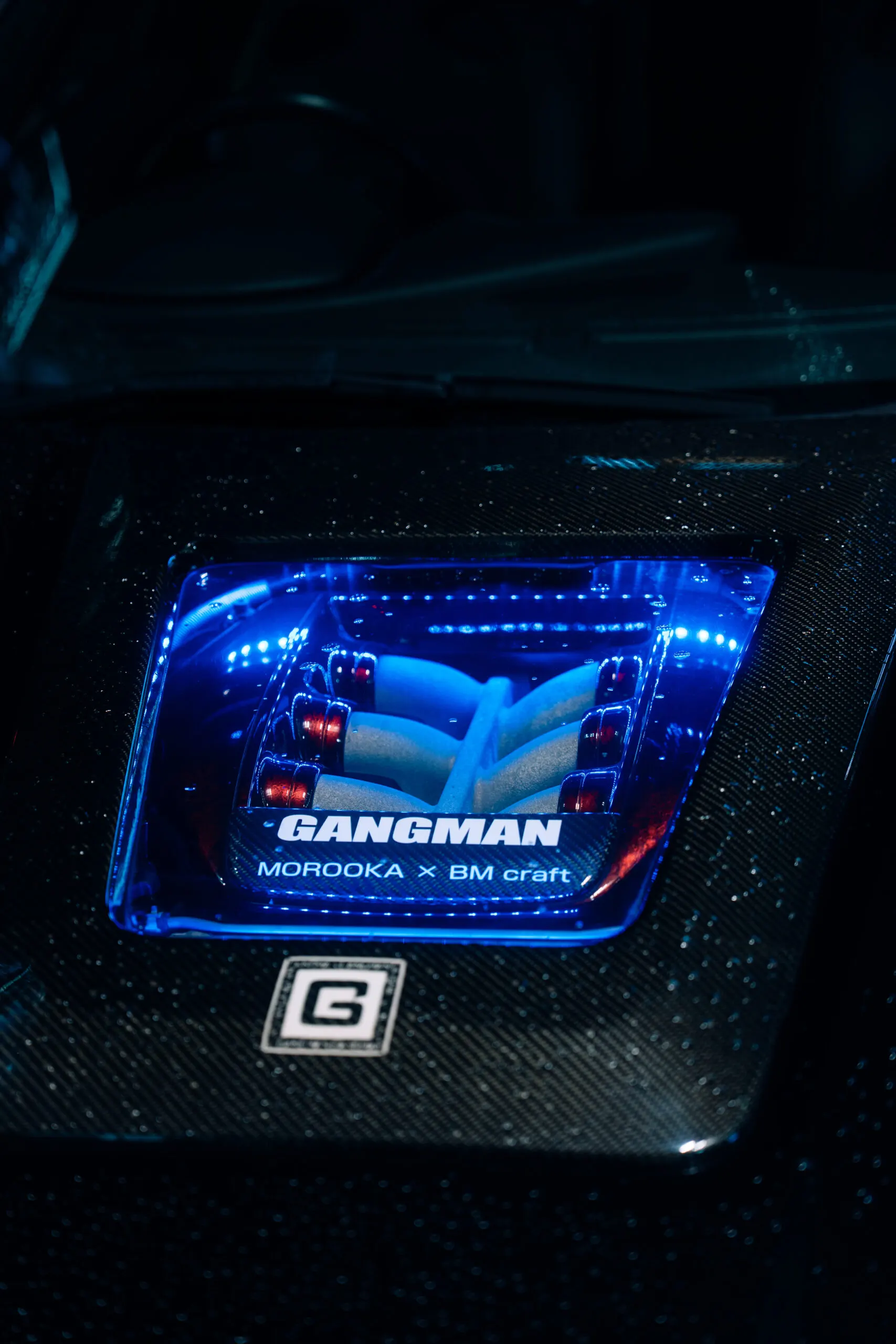 Illuminated engine bay detail with blue light